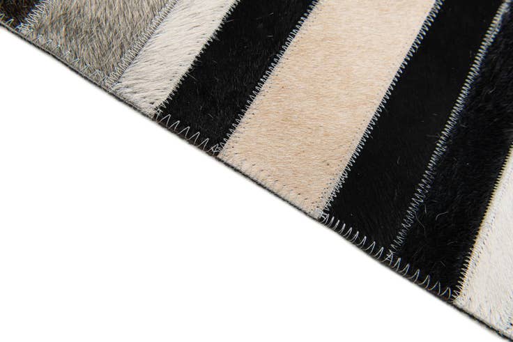 Detail image of 5' 1 x 7' 11 Cowhide Stocks Rug