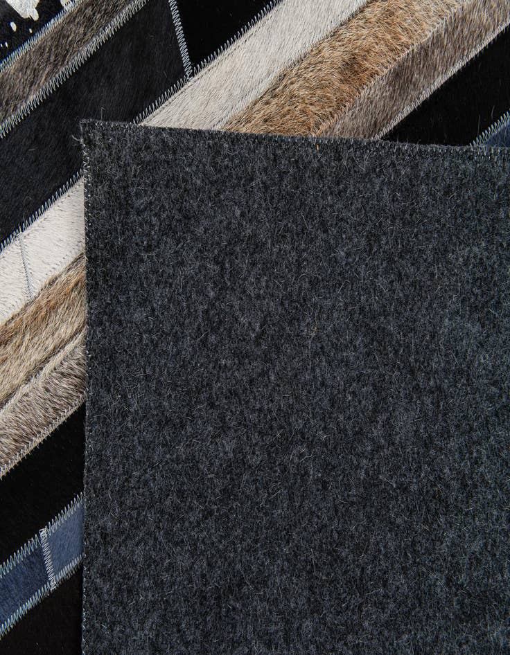 Detail image of 5' 1 x 7' 11 Cowhide Stocks Rug