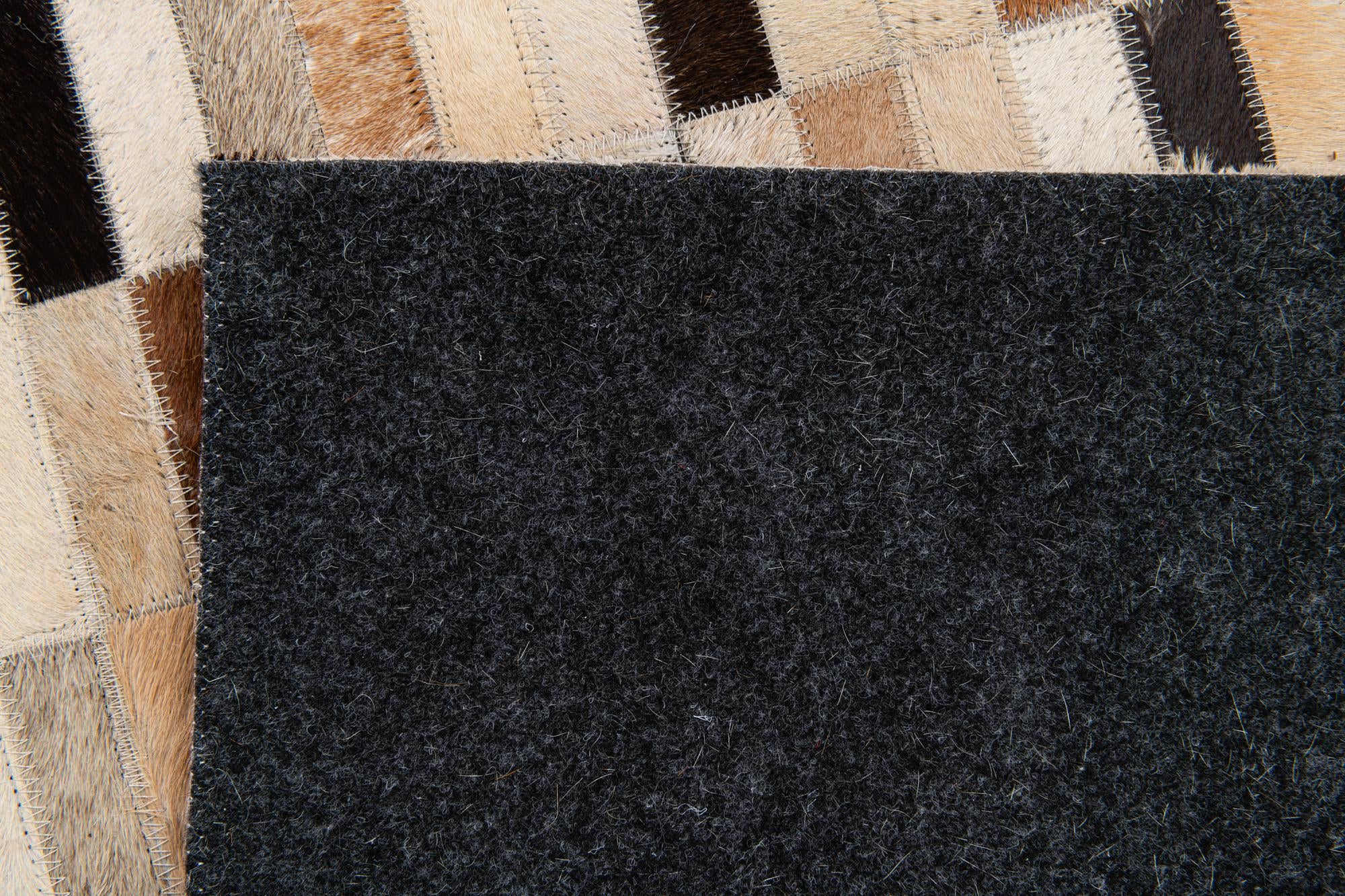 4' 11 x 7' 10 Cowhide Stocks Rug