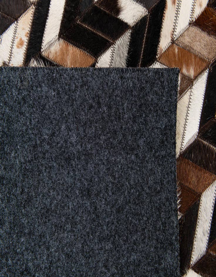 Detail image of 4' 11 x 8' Cowhide Stocks Rug