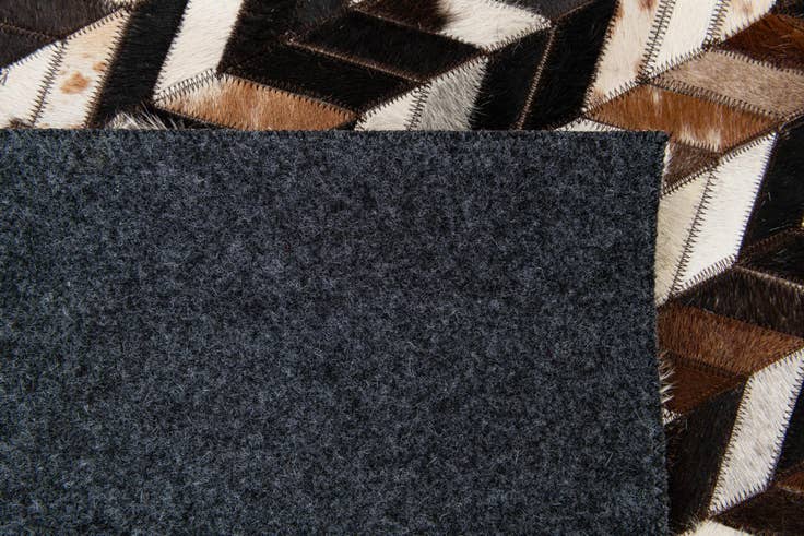 Detail image of 4' 11 x 8' Cowhide Stocks Rug