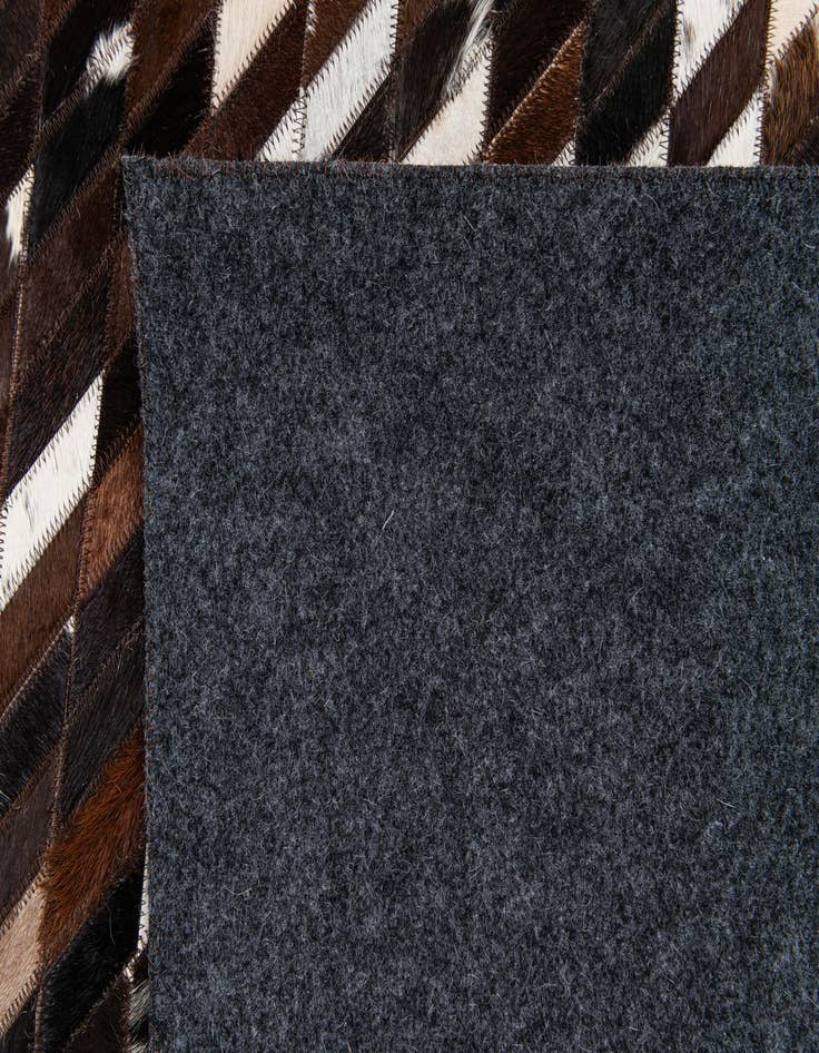 Detail image of 5' x 7' 11 Cowhide Stocks Rug