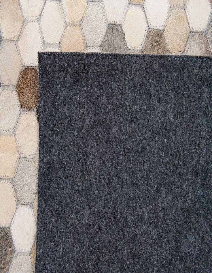 Detail image of 4' 11 x 7' 8 Cowhide Stocks Rug