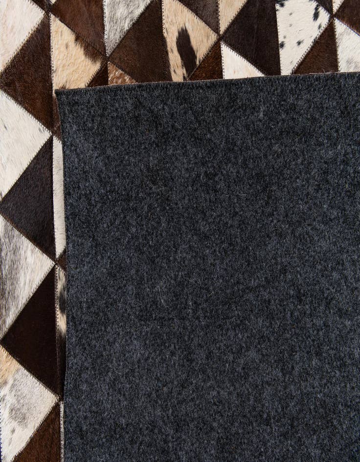 Detail image of 5' 1 x 8' 1 Cowhide Stocks Rug