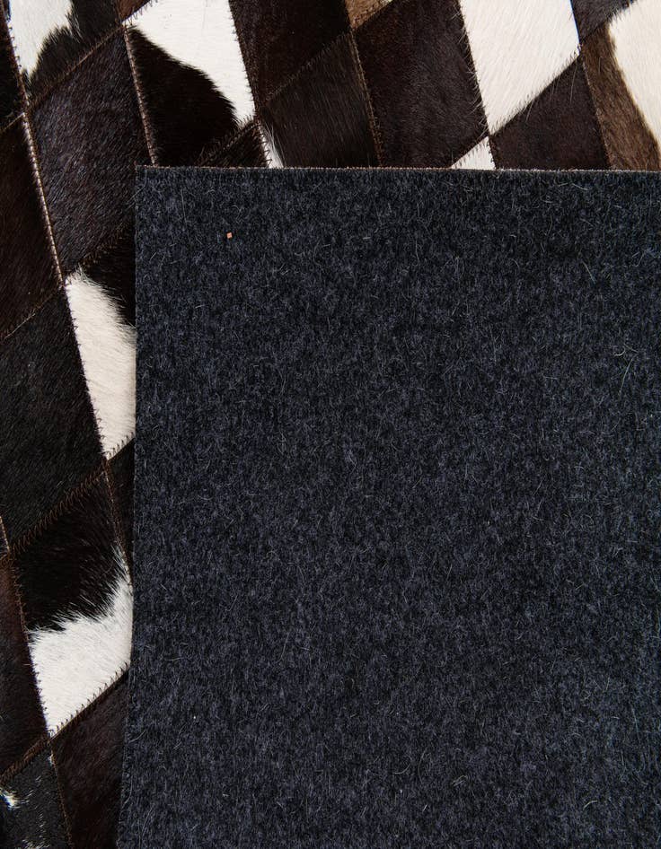 Detail image of 5' x 7' 11 Cowhide Stocks Rug