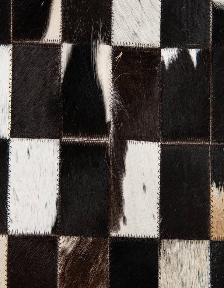 Detail image of 5' x 7' 11 Cowhide Stocks Rug