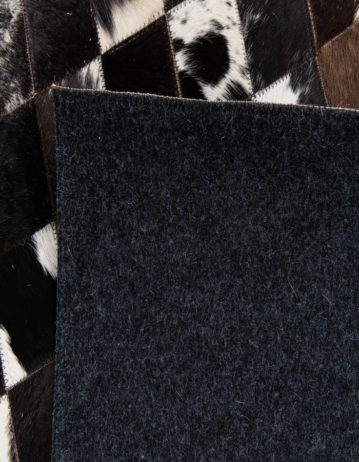 Detail image of 5' x 7' 11 Cowhide Stocks Rug