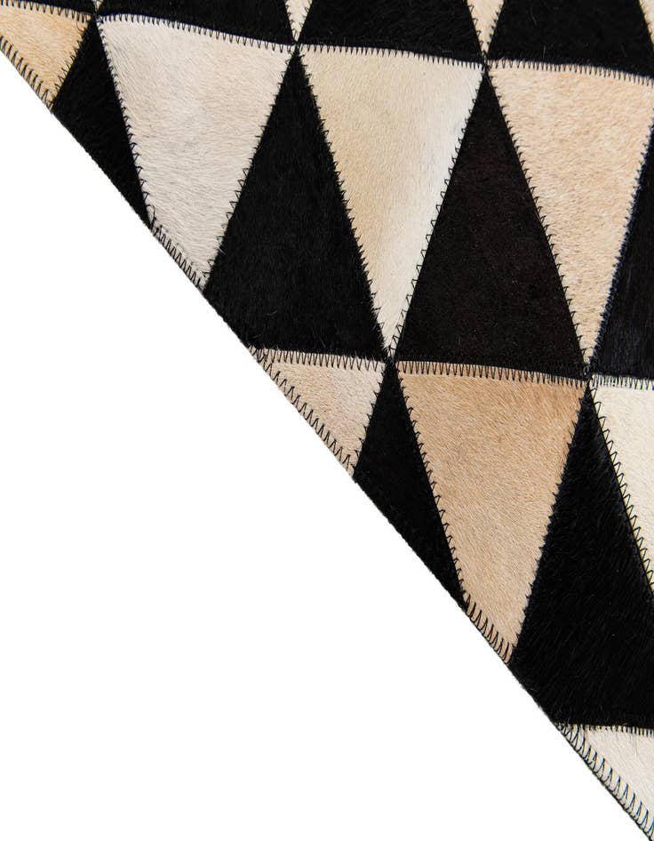 Detail image of 5' 1 x 8' 1 Cowhide Stocks Rug