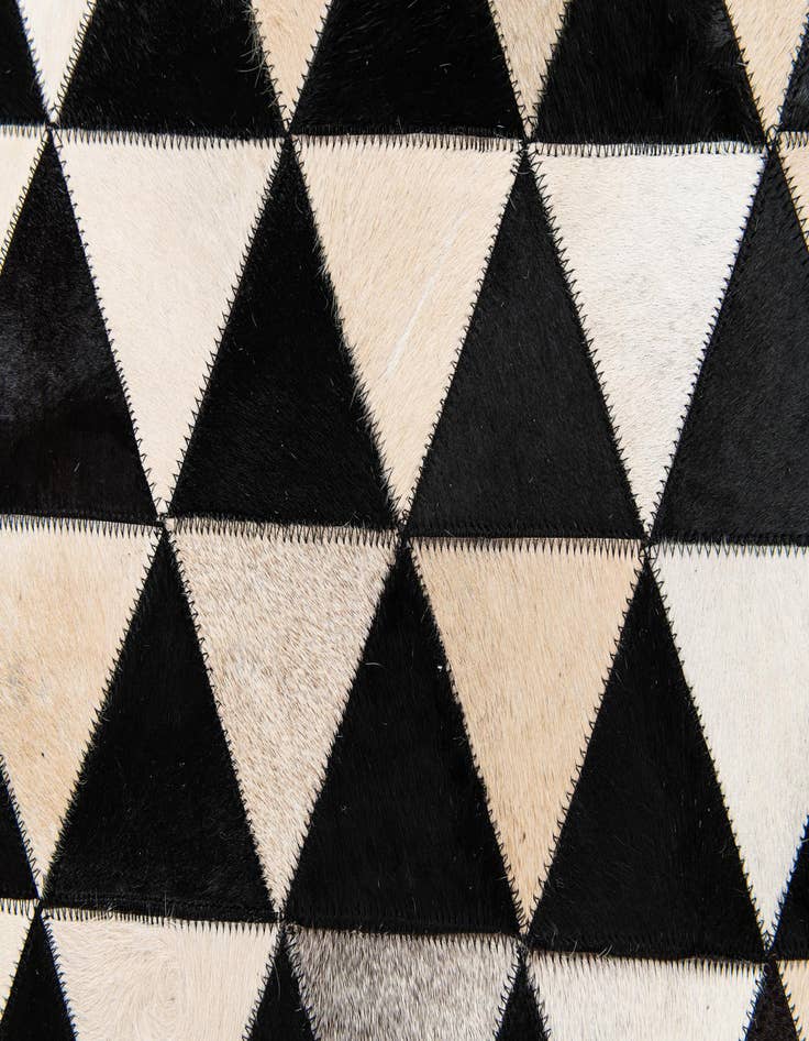 Detail image of 5' 1 x 8' 1 Cowhide Stocks Rug