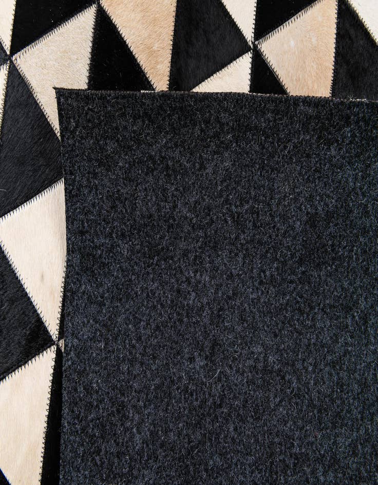 Detail image of 5' 1 x 8' 1 Cowhide Stocks Rug