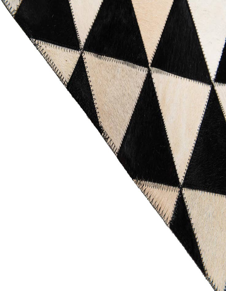 Detail image of 5' 1 x 8' 2 Cowhide Stocks Rug