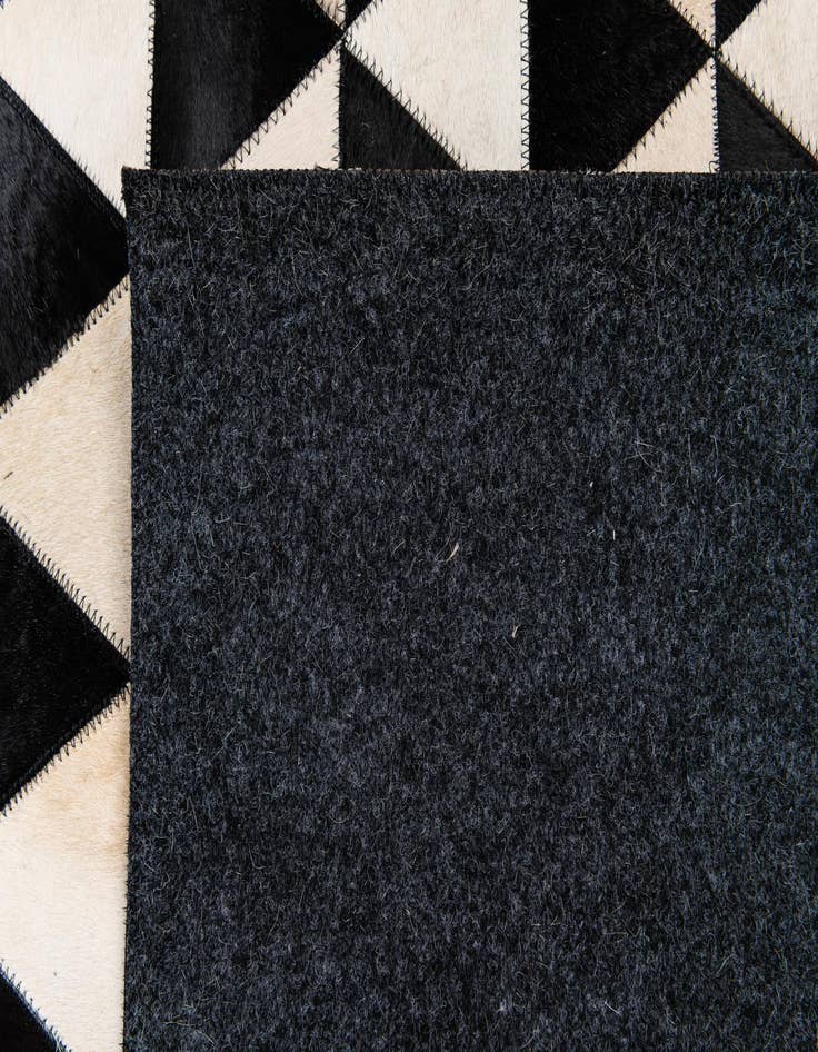 Detail image of 5' 1 x 8' 2 Cowhide Stocks Rug