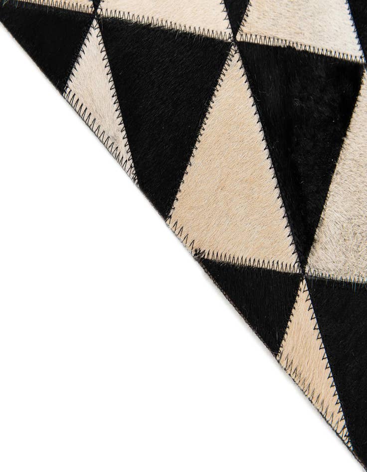 Detail image of 5' 1 x 8' 2 Cowhide Stocks Rug