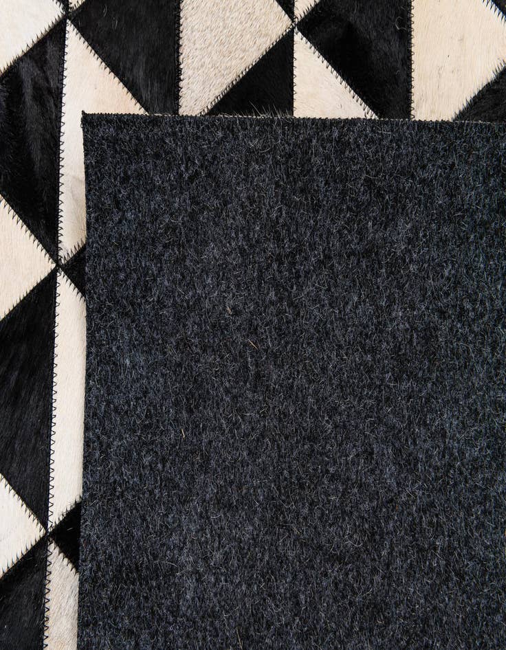 Detail image of 5' 1 x 8' 2 Cowhide Stocks Rug