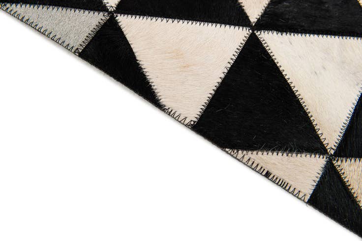 Detail image of 5' 1 x 8' 2 Cowhide Stocks Rug