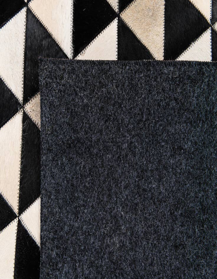 Detail image of 5' 1 x 8' 2 Cowhide Stocks Rug