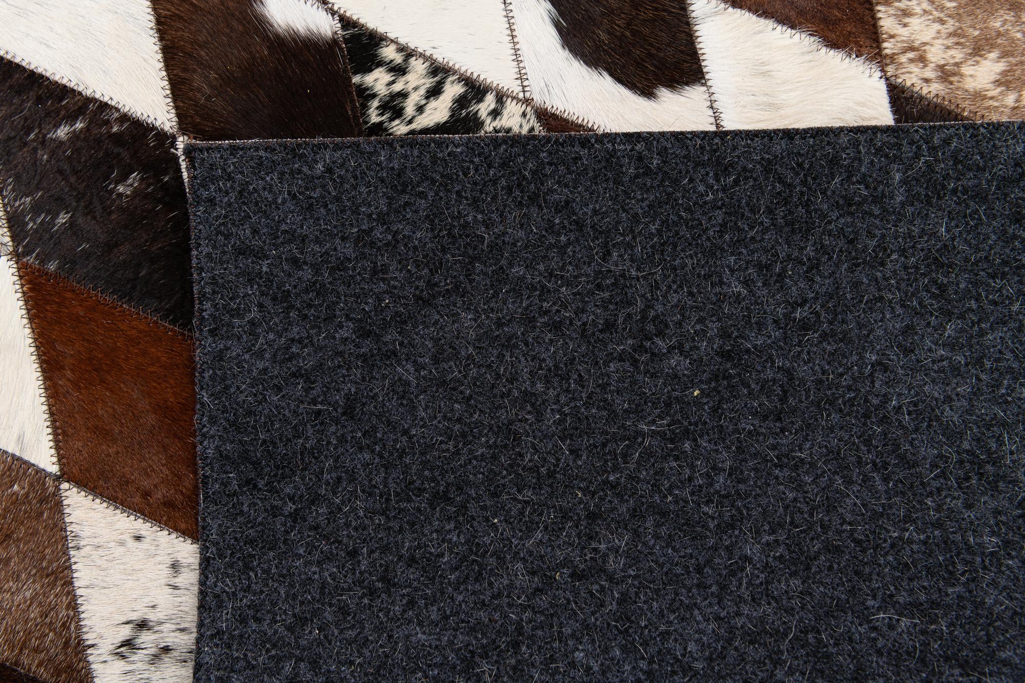 5' 7 x 8' Cowhide Stocks Rug