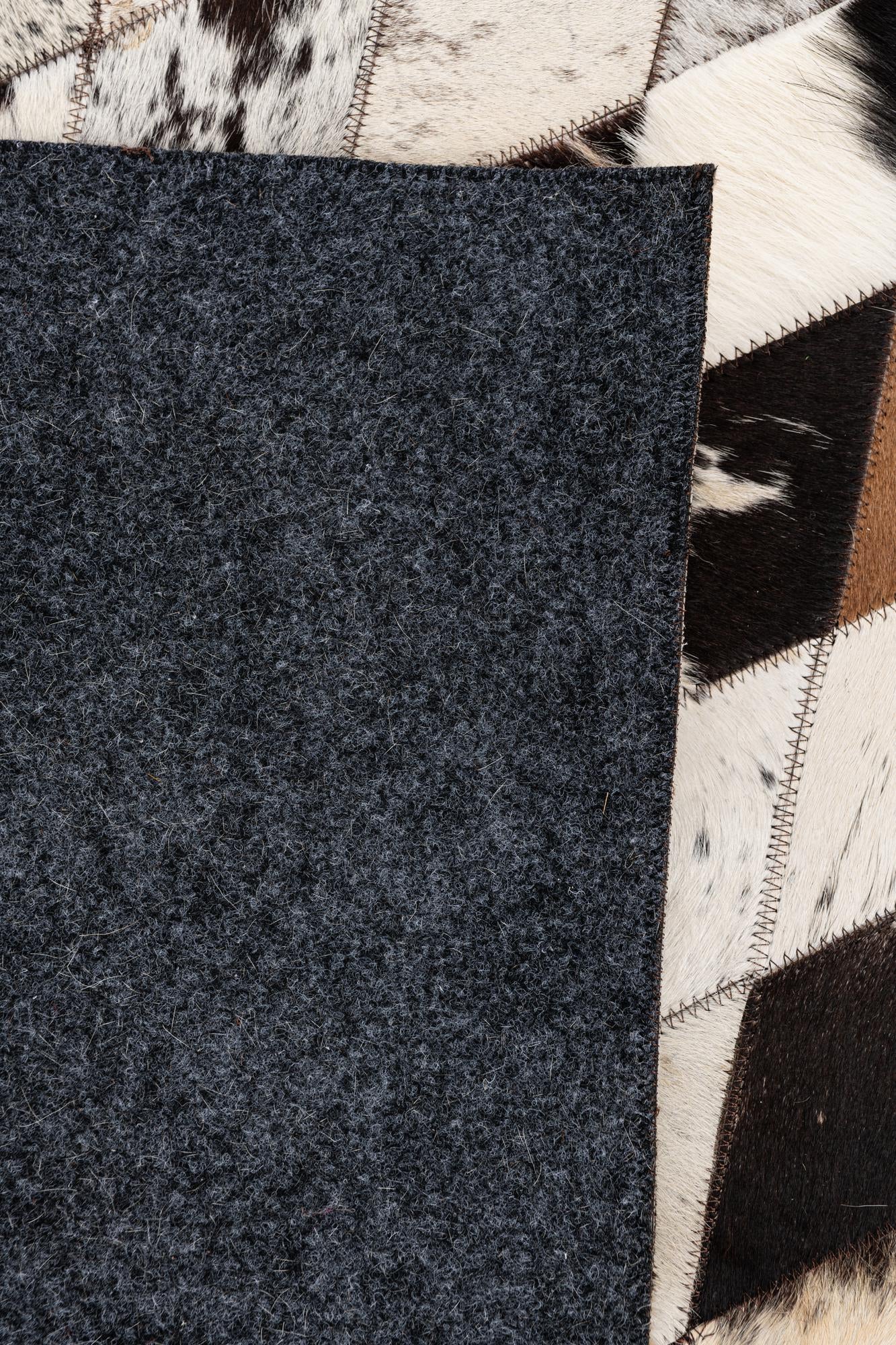 5' 7 x 8' Cowhide Stocks Rug