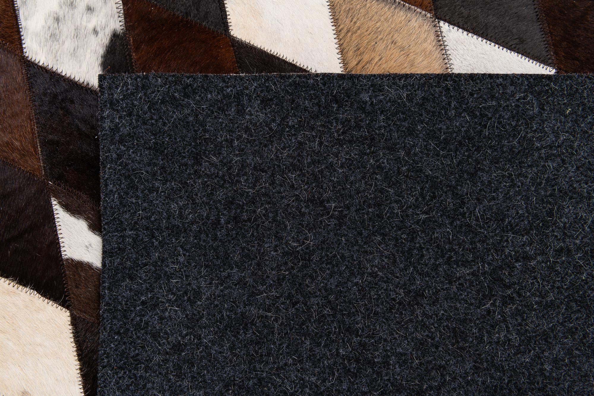 5' 2 x 8' 1 Cowhide Stocks Rug