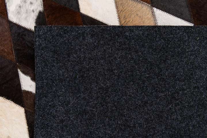 5' 2 x 8' 1 Cowhide Stocks Rug
