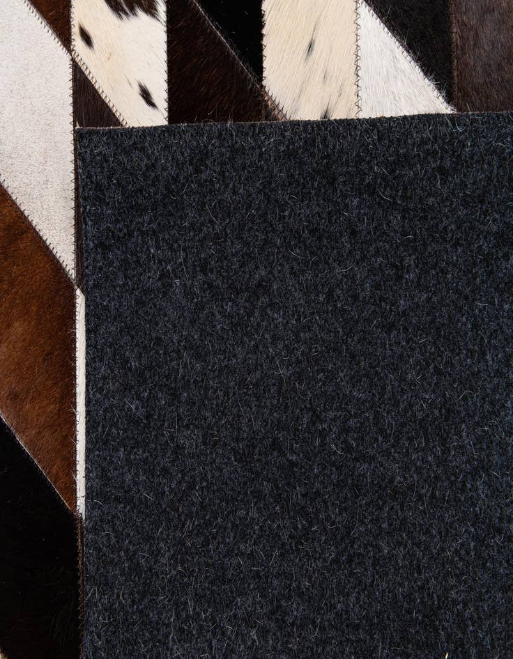 Detail image of 5' 3 x 8' Cowhide Stocks Rug