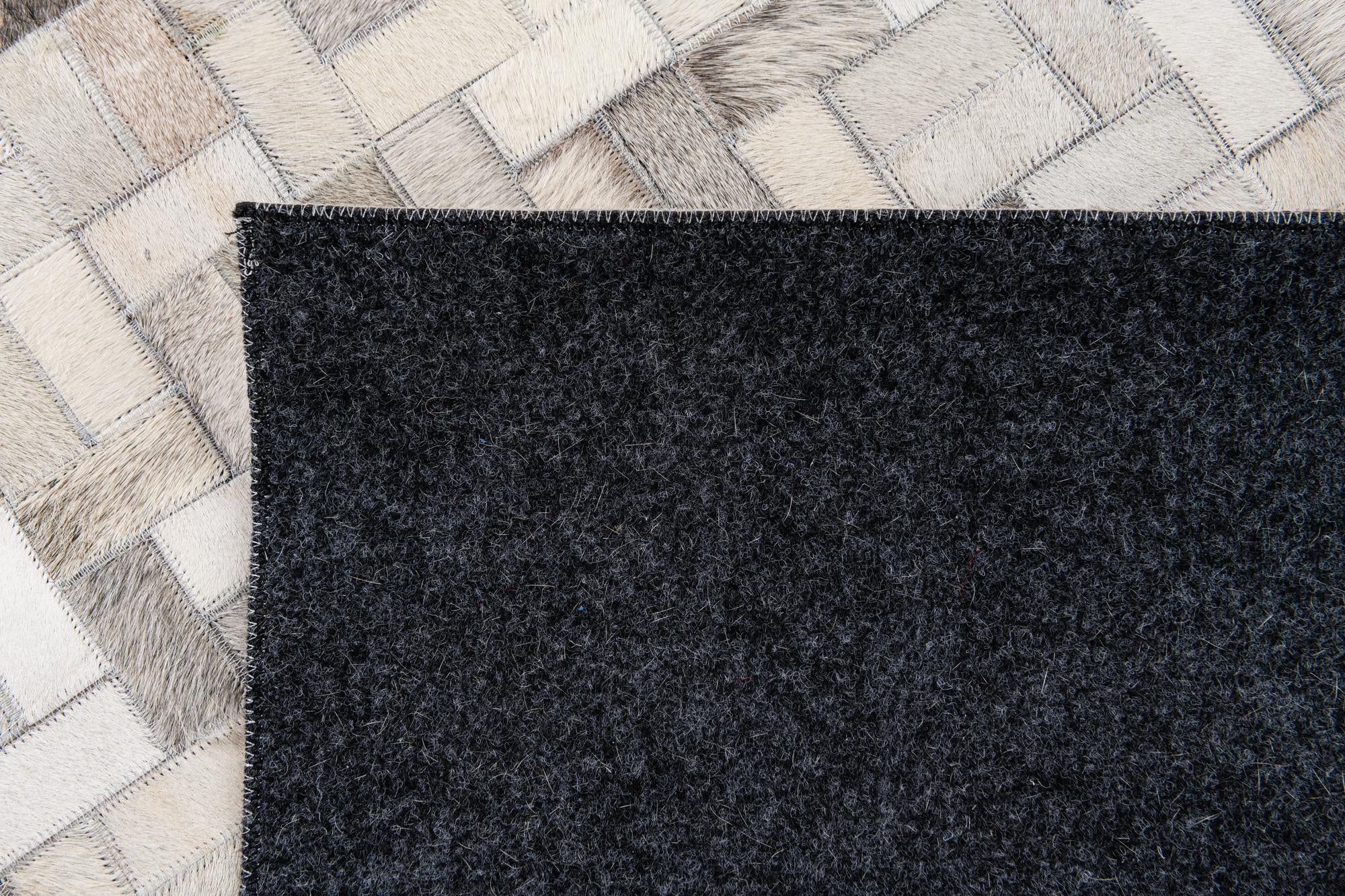 5' 7 x 7' 10 Cowhide Stocks Rug