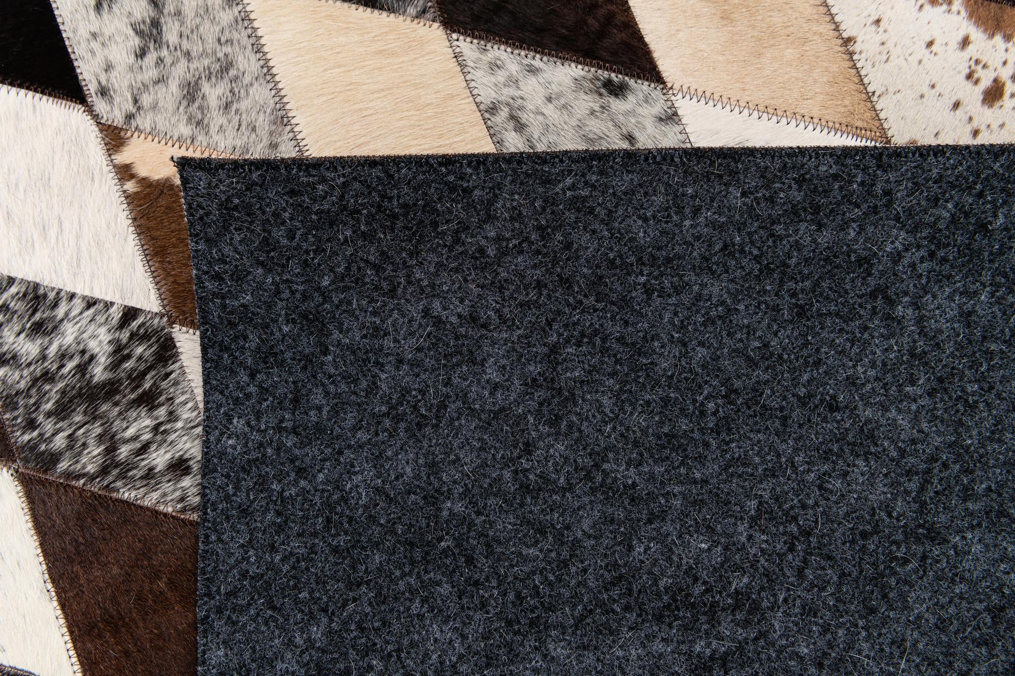 5' 7 x 7' 10 Cowhide Stocks Rug