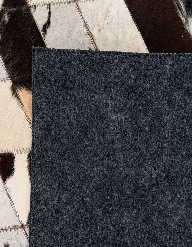 Detail image of 5' 7 x 8' Cowhide Stocks Rug