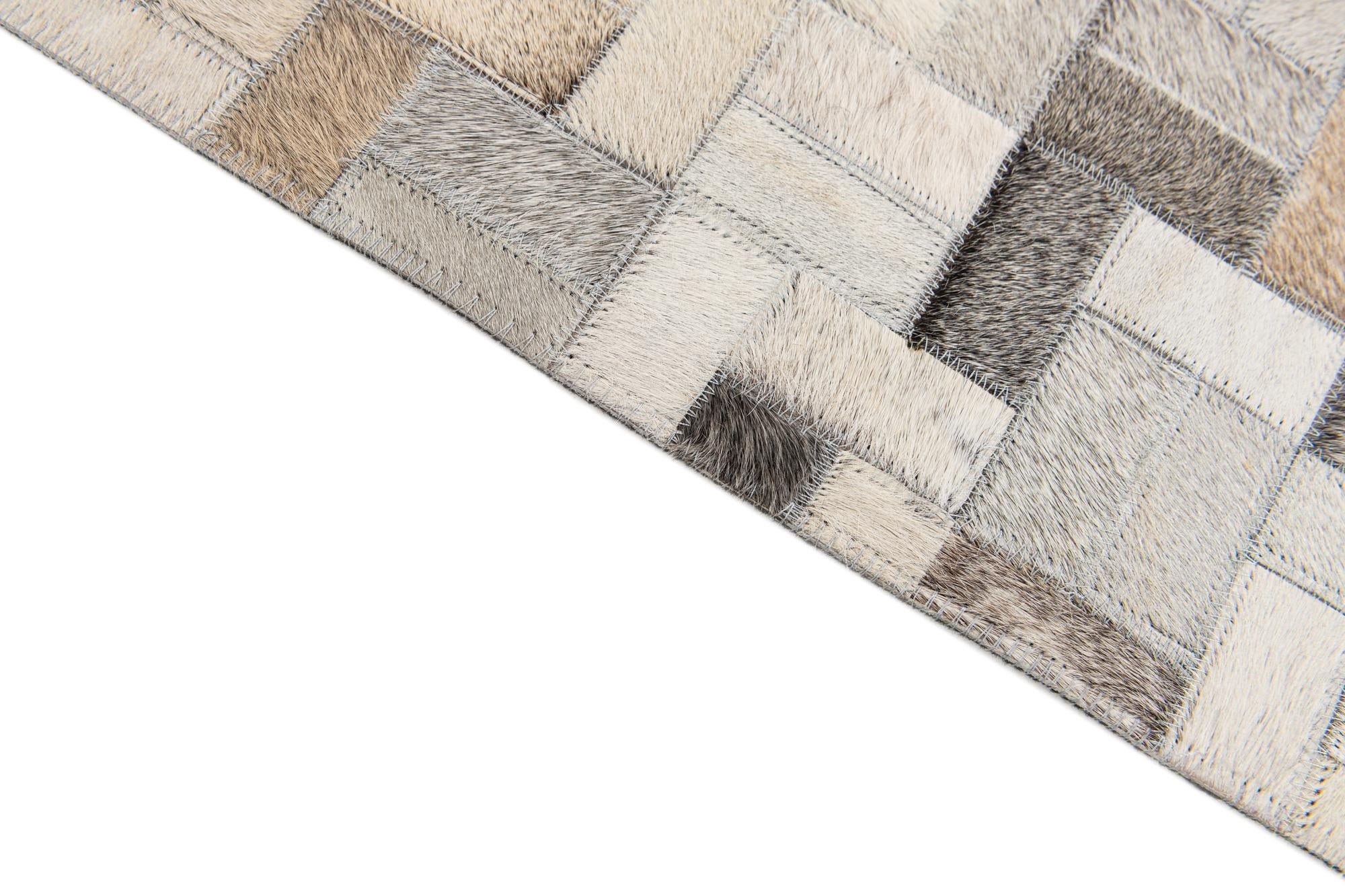 5' 7 x 7' 10 Cowhide Stocks Rug