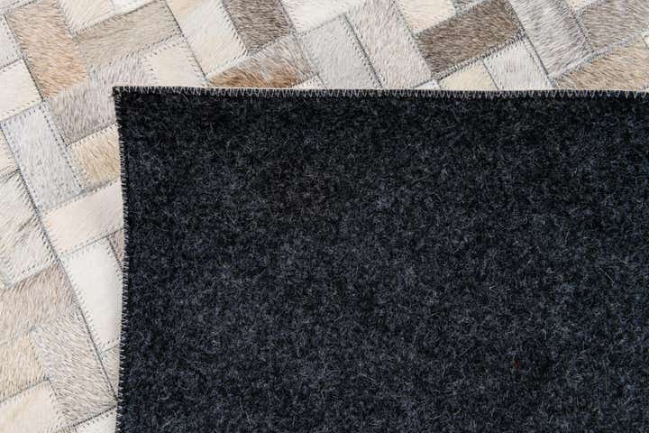 5' 7 x 7' 10 Cowhide Stocks Rug