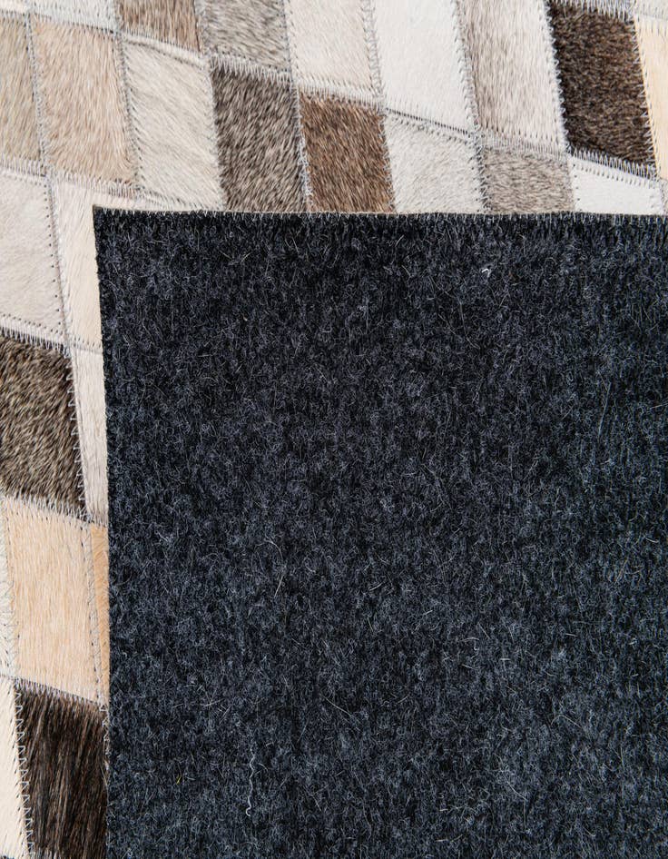 Detail image of 5' 6 x 8' Cowhide Stocks Rug