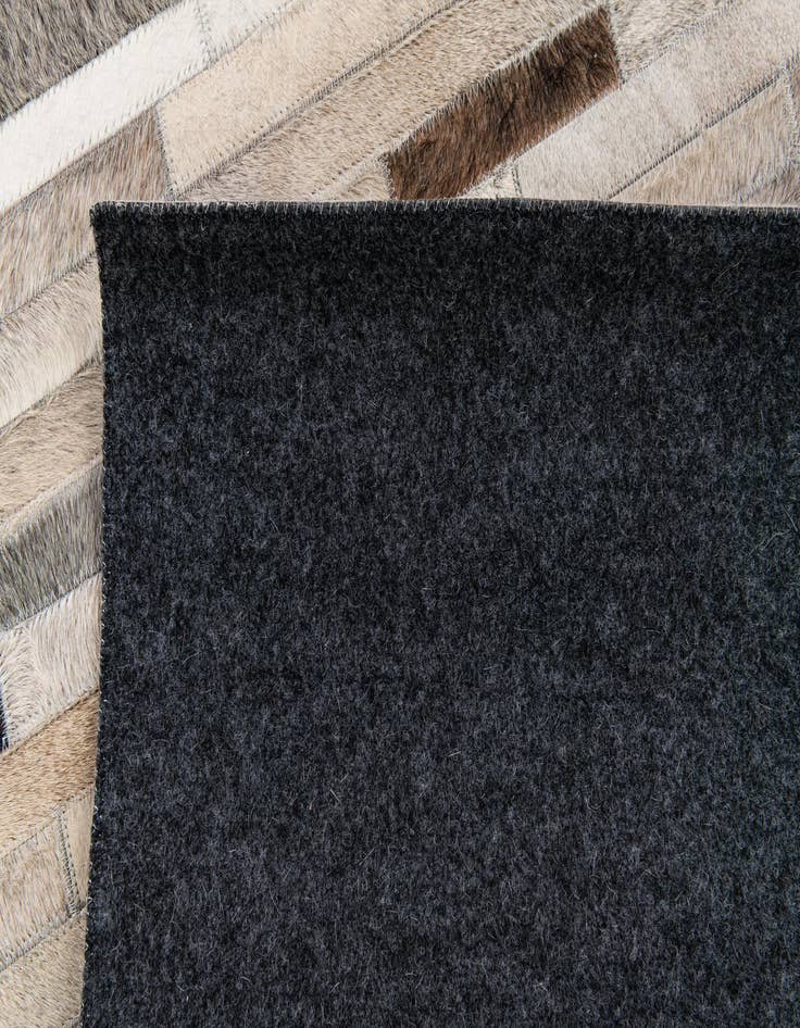Detail image of 5' 1 x 7' 11 Cowhide Stocks Rug