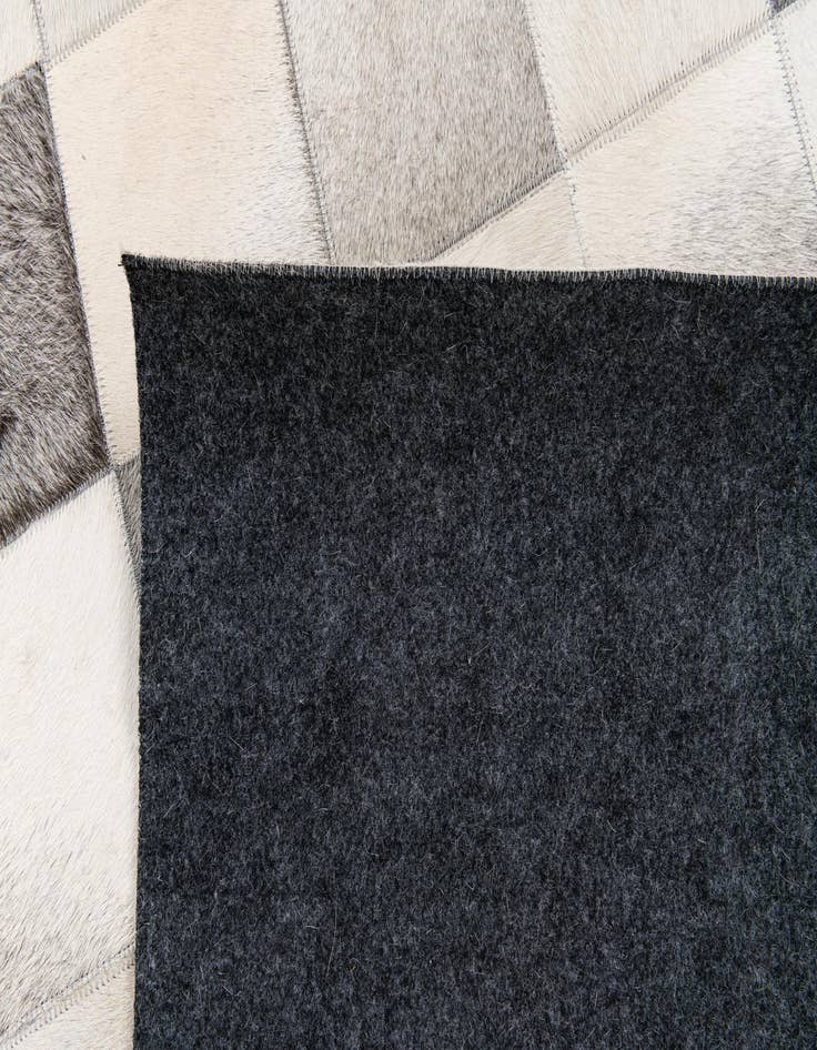 Detail image of 5' x 7' 11 Cowhide Stocks Rug