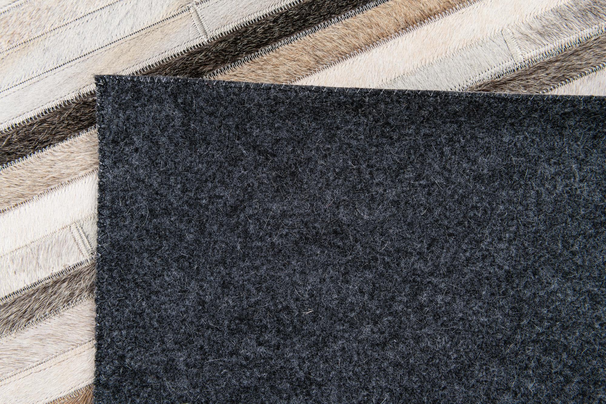 5' 1 x 8' Cowhide Stocks Rug
