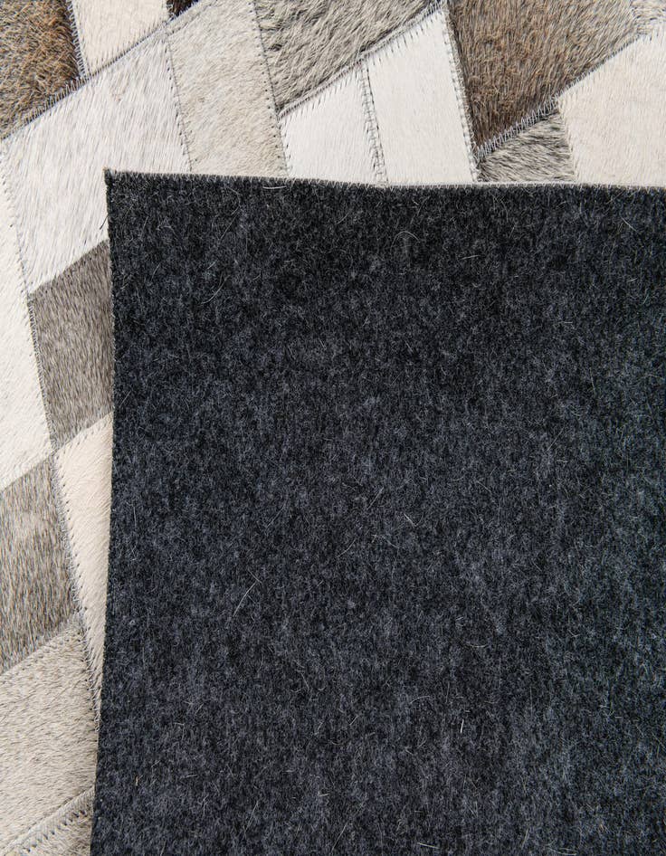 Detail image of 5' 1 x 8' Cowhide Stocks Rug