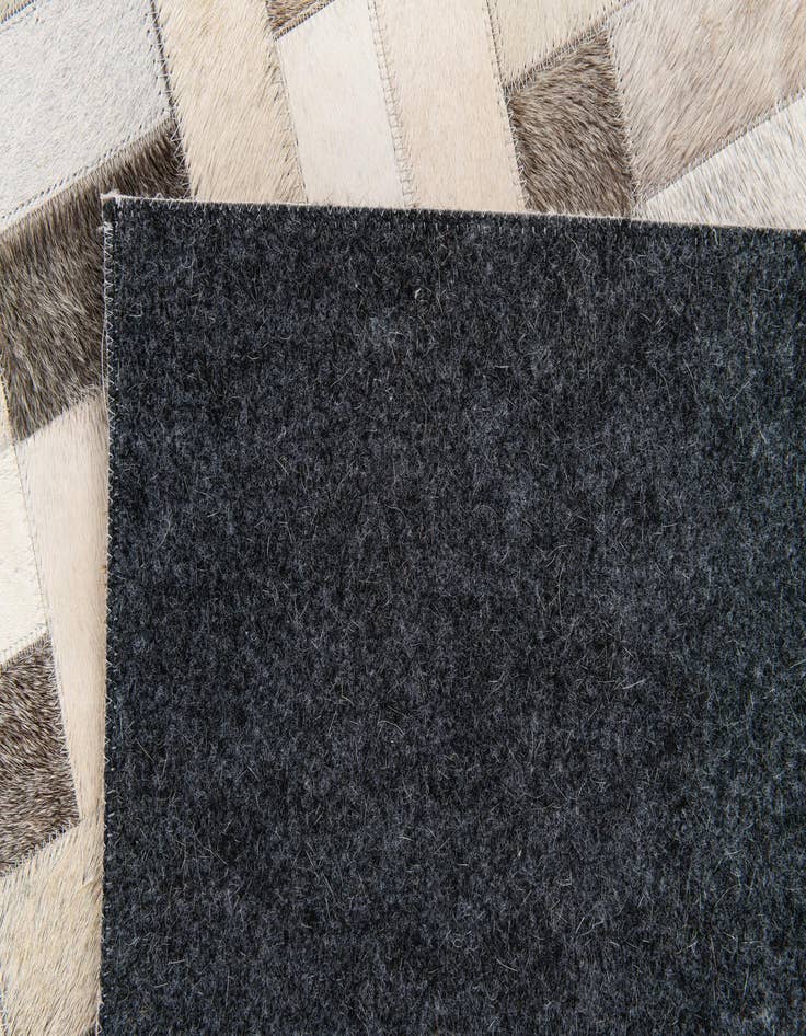 Detail image of 5' x 7' 11 Cowhide Stocks Rug