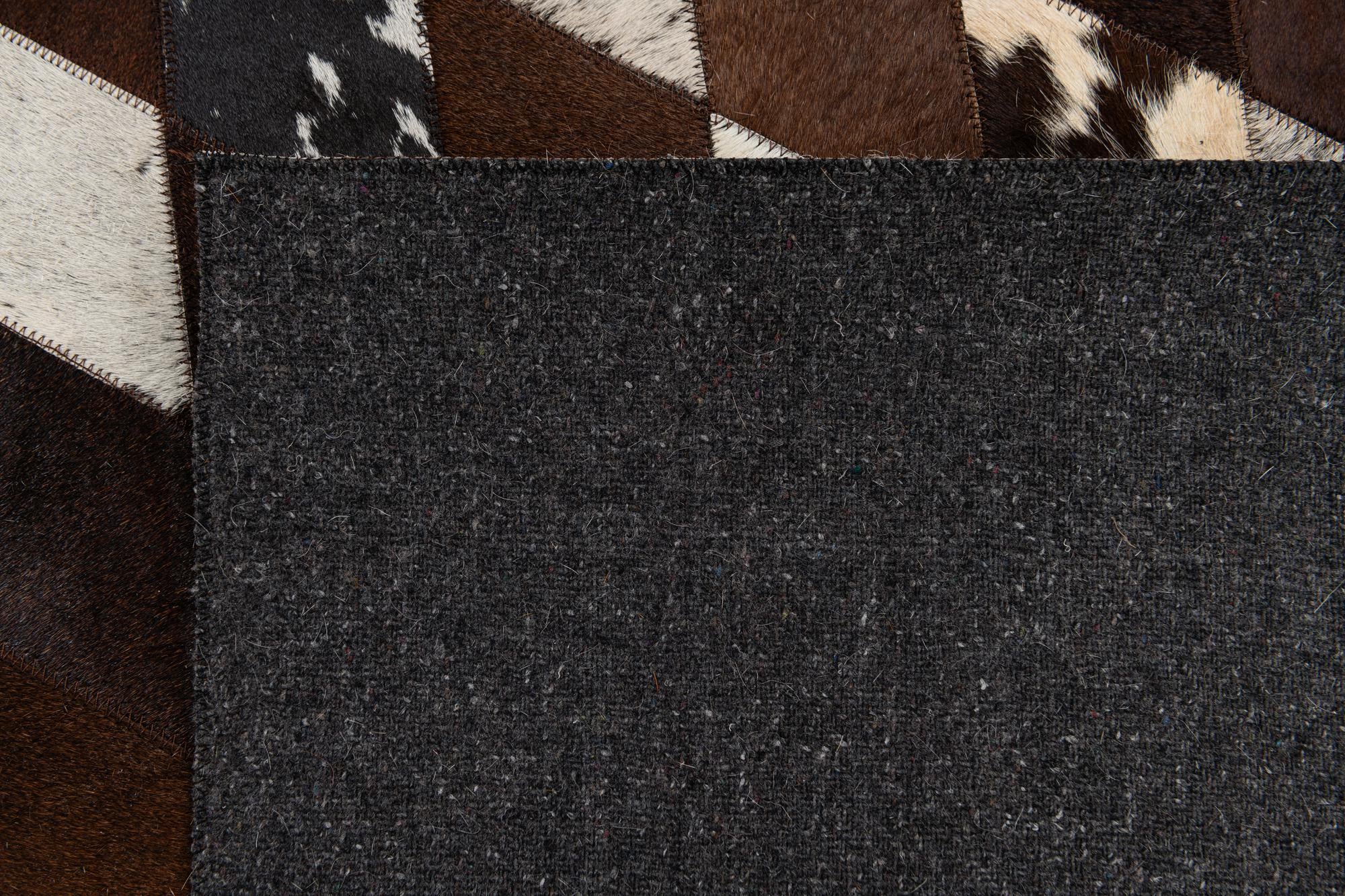 5' 2 x 8' 1 Cowhide Stocks Rug