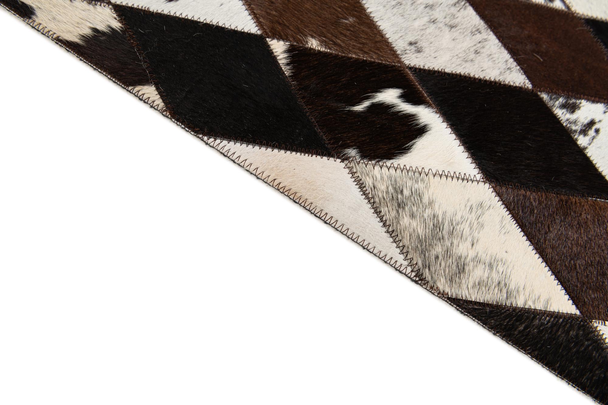 5' 2 x 8' 1 Cowhide Stocks Rug