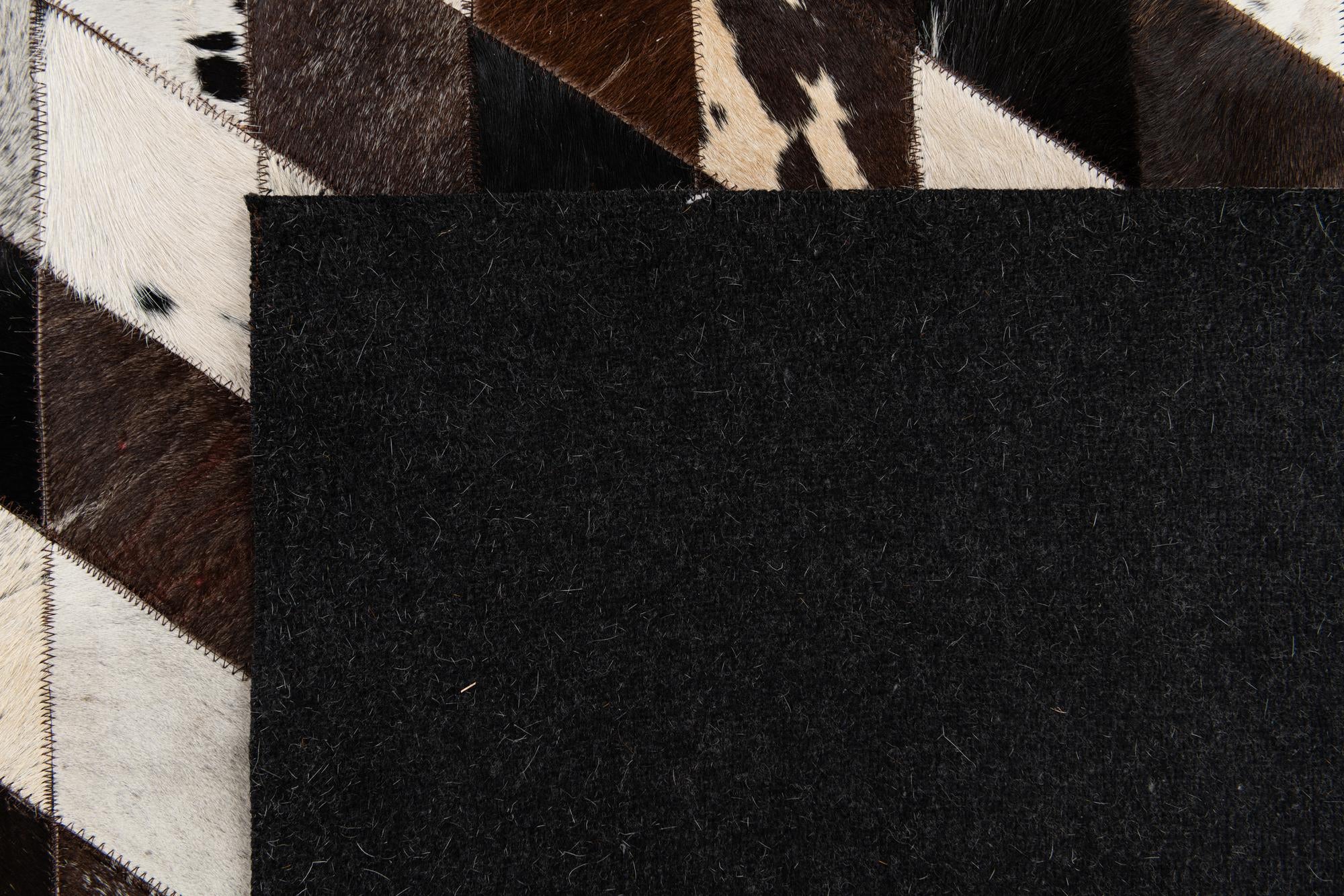 5' 2 x 8' 1 Cowhide Stocks Rug
