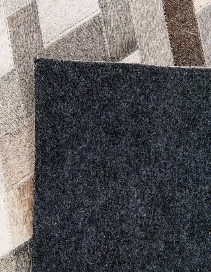 Detail image of 5' 1 x 8' Cowhide Stocks Rug