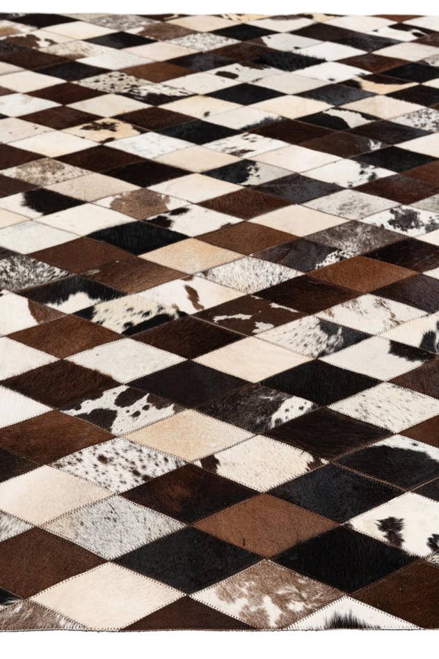 Detail image of 5' 1 x 8' 1 Cowhide Stocks Rug