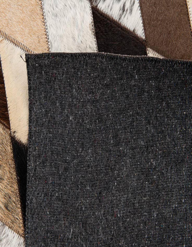 Detail image of 5' 1 x 8' 1 Cowhide Stocks Rug
