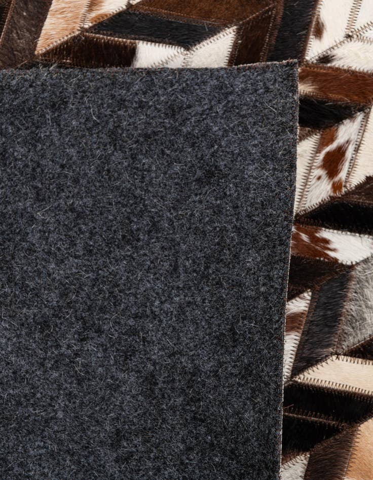 Detail image of 4' 11 x 8' Cowhide Stocks Rug