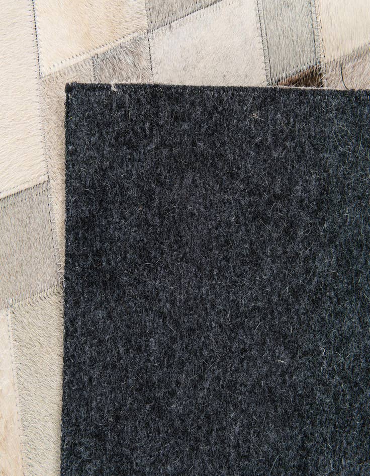 Detail image of 5' x 7' 11 Cowhide Stocks Rug