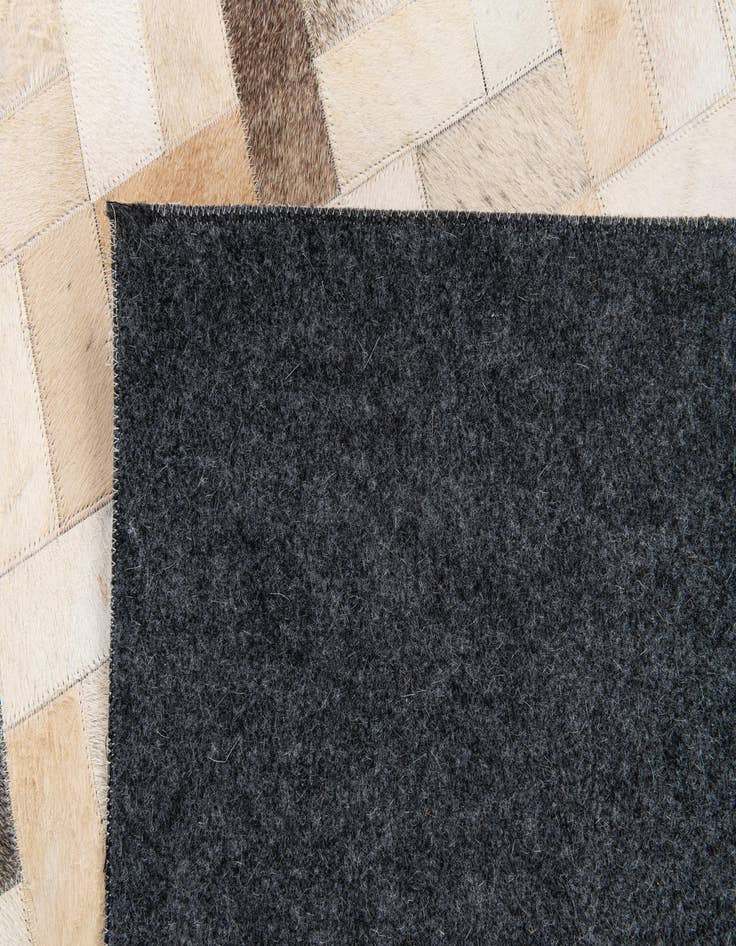 Detail image of 5' 1 x 8' Cowhide Stocks Rug