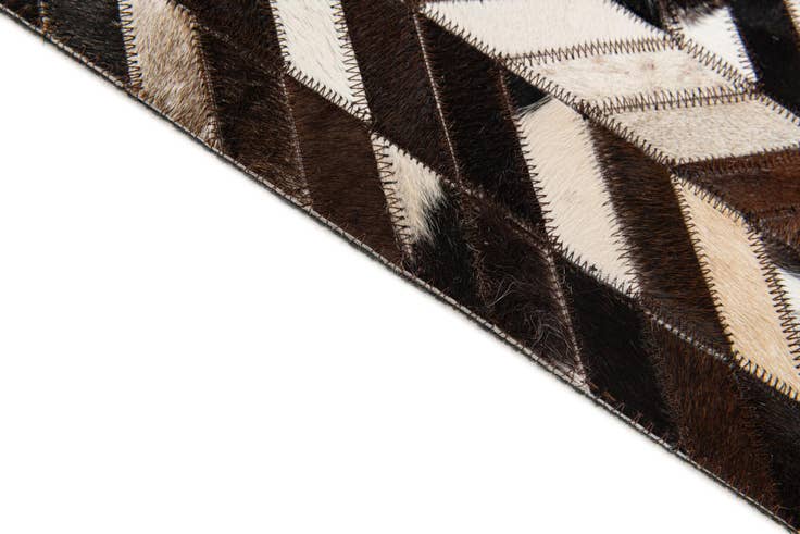 Detail image of 4' 11 x 8' Cowhide Stocks Rug