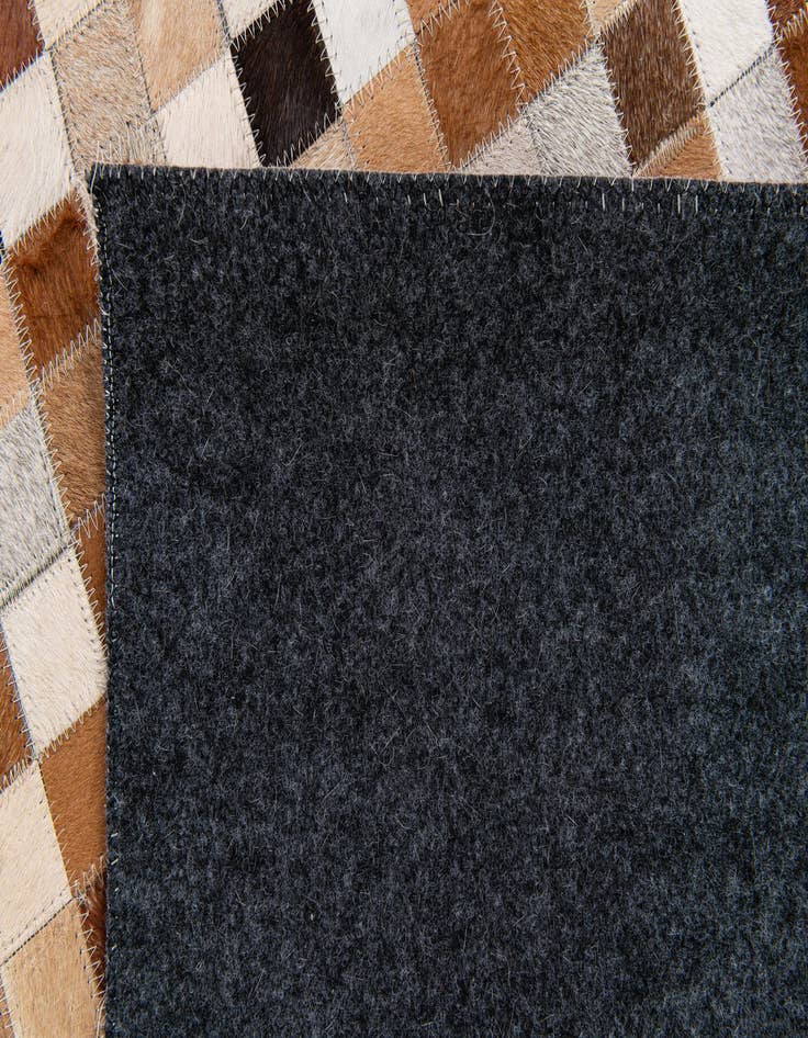 Detail image of 5' x 7' 11 Cowhide Stocks Rug