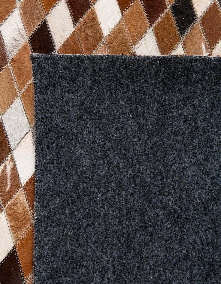 Detail image of 5' x 7' 11 Cowhide Stocks Rug