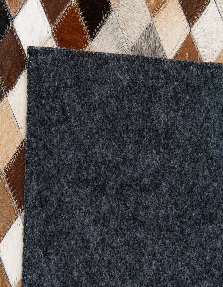 Detail image of 5' x 7' 11 Cowhide Stocks Rug