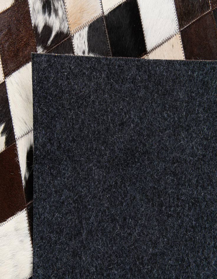 Detail image of 5' x 7' 11 Cowhide Stocks Rug